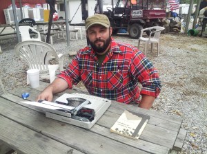 Luke Austin Daugherty writing in Friendship, IN. Photo Credit: Nathanael Daugherty 